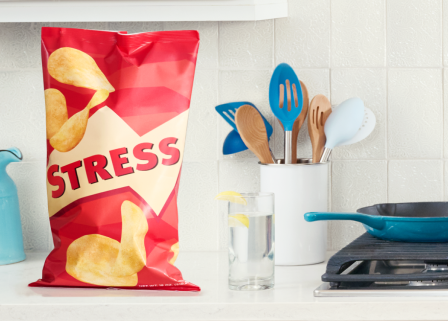 A bag of stress labeled chips on a kitchen counter for emotional eating